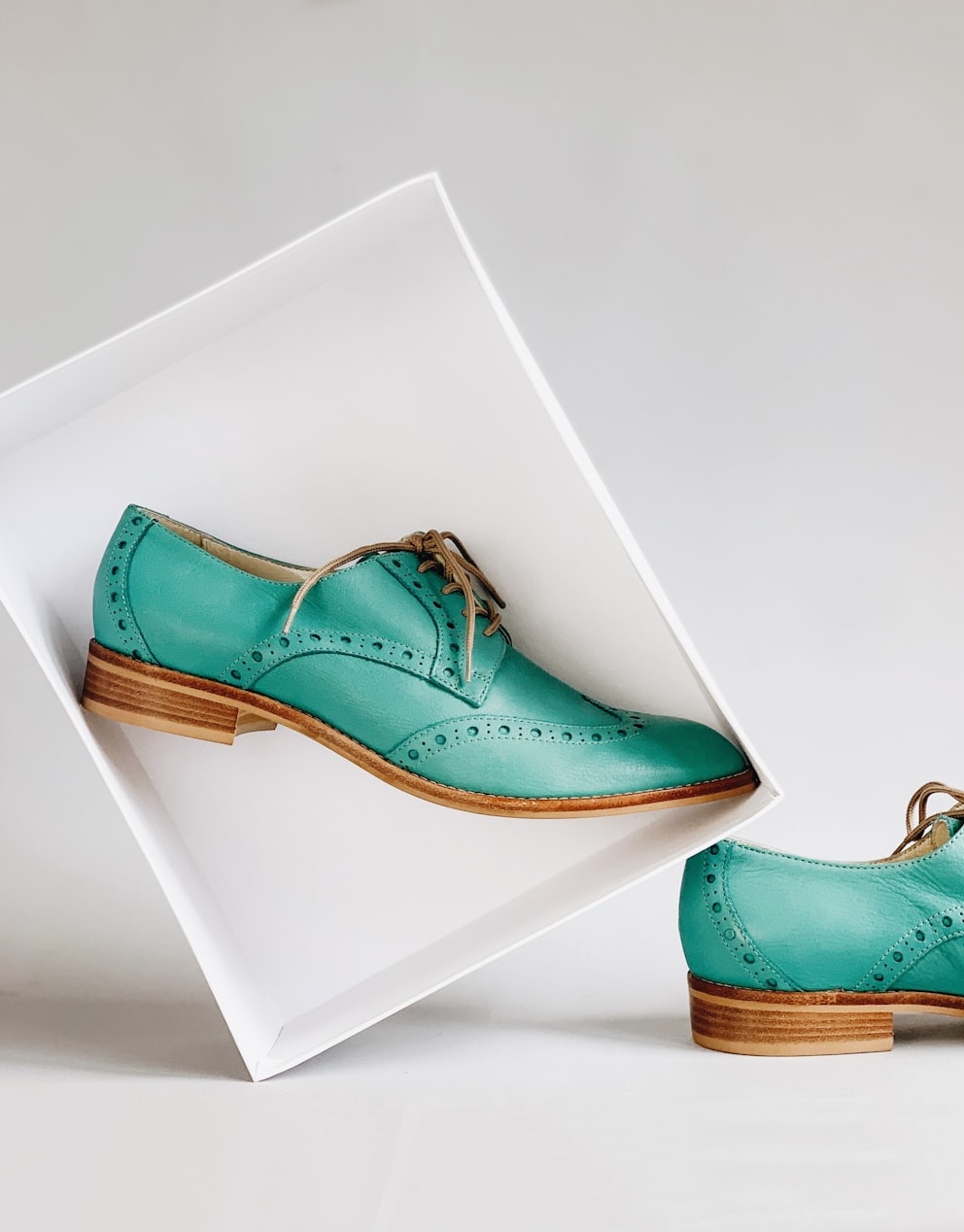 Green wingtip shoes
